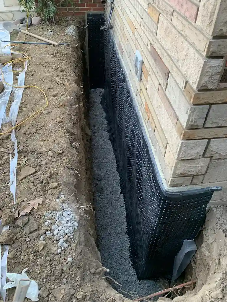 Exterior basement waterproofing membrane installed on a Toronto foundation wall